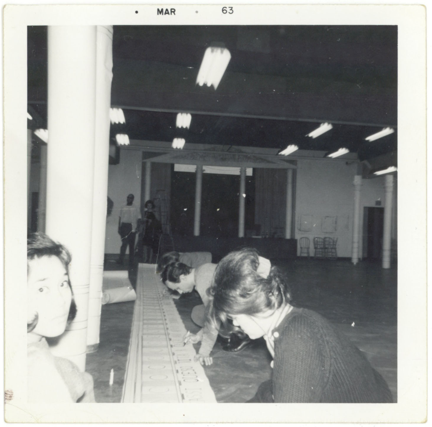 black and white photo of women drawing