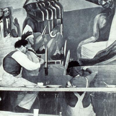 Two painters creating a fresco on a wall. 